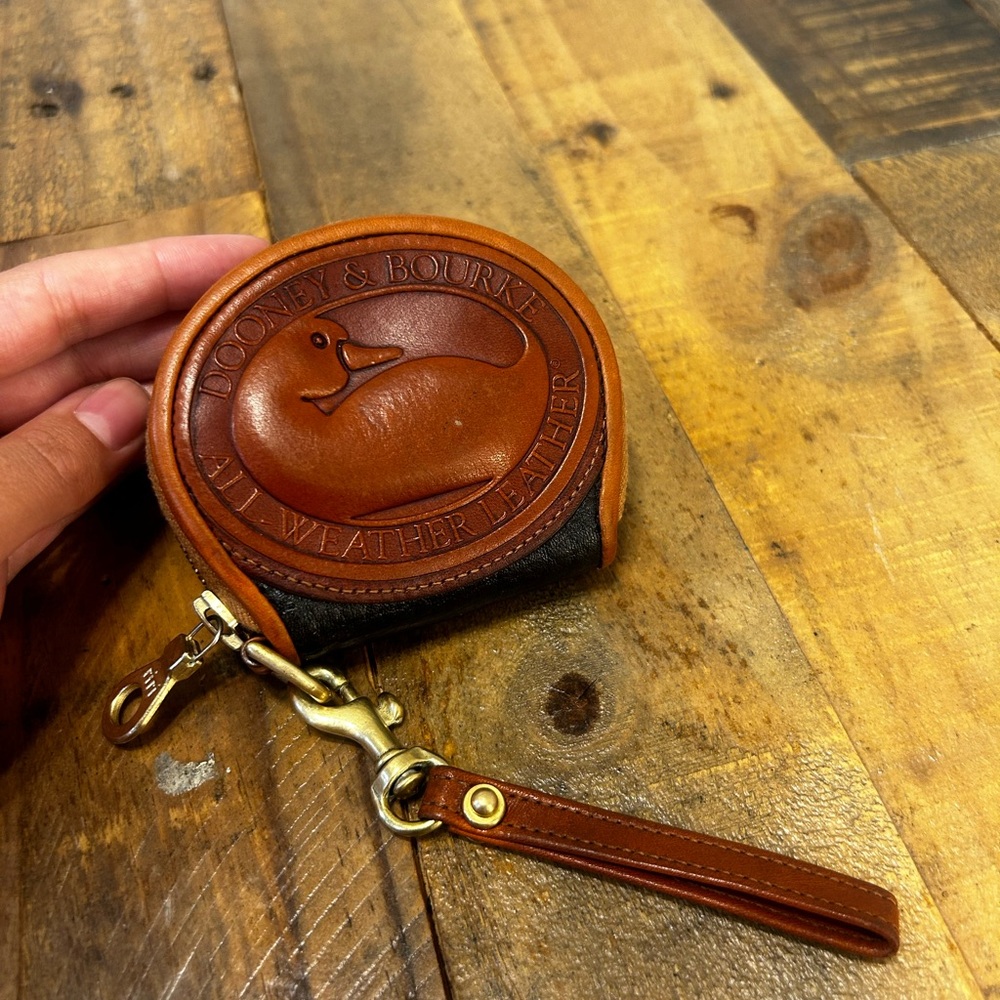 Dooney & Bourke All Weather Leather Round Coin Purse Black & Tan with Strap